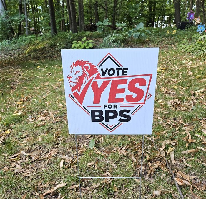 A Vote Yes for BPS yard sign displayed in a yard